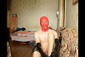 Naked person jerks gone in latex knee socks and long gloves